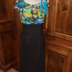 Vibrant color top w black bottom.